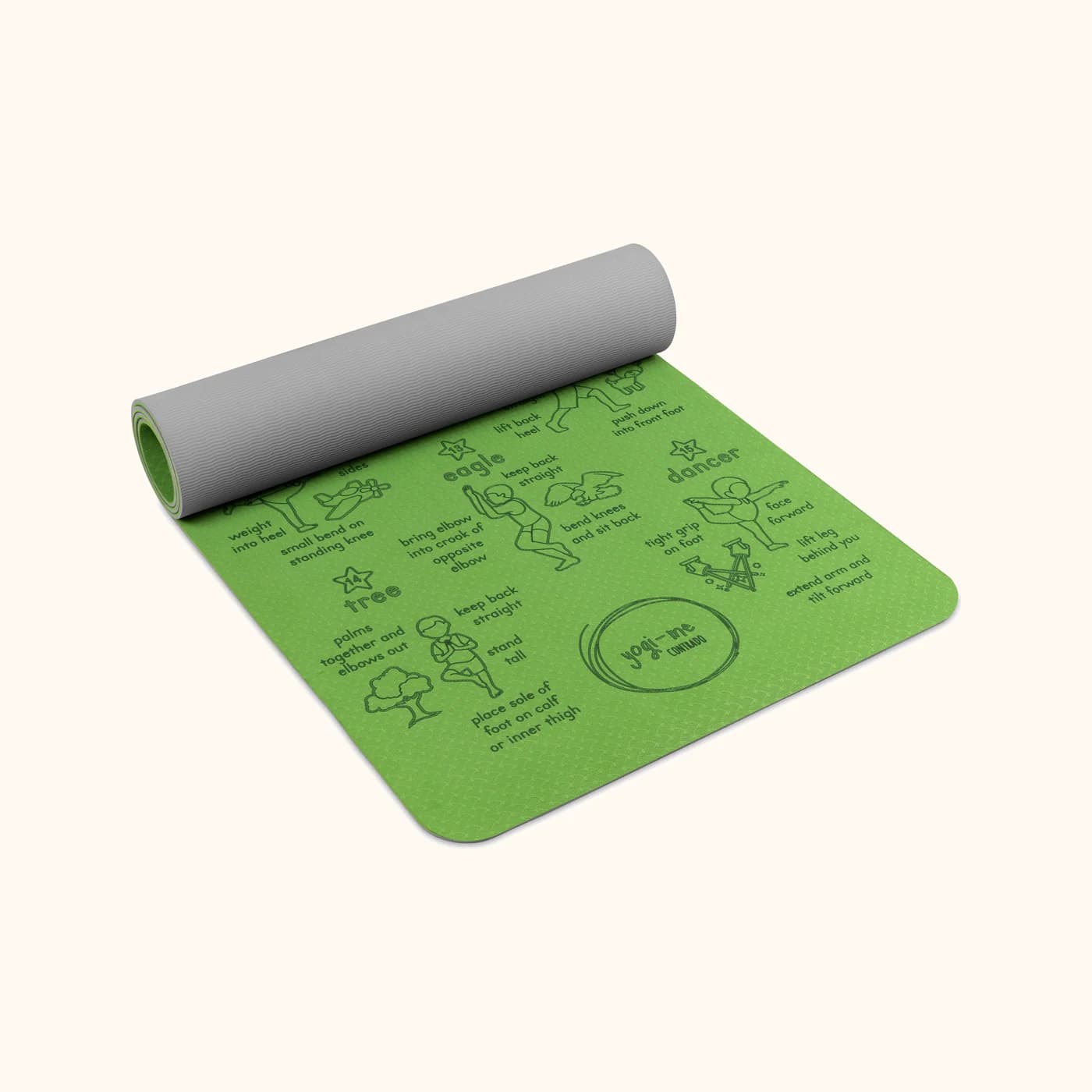 Sun Salutation kids' yoga mat in green: The mat part-rolled, showing its thickness and the grey underside